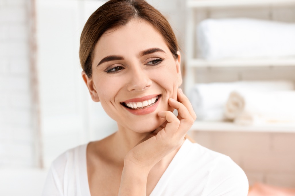 Young,Woman,With,Beautiful,Smile,Indoors.,Teeth,Whitening