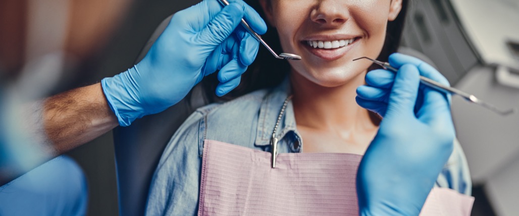 Attractive,Young,Woman,In,Stomatology,Clinic,With,Male,Dentist.,Healthy