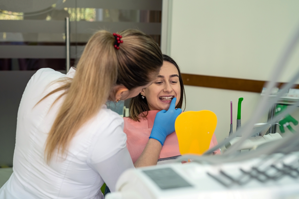 The,Dentist,And,The,Patient,Look,In,The,Mirror,After